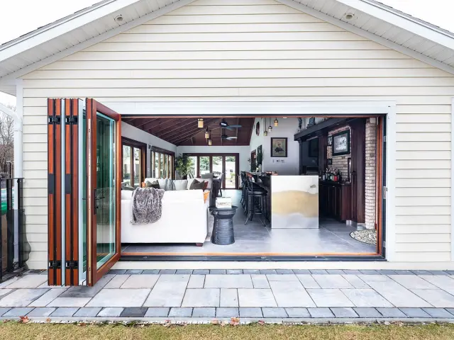 Four season room addition with folding doors